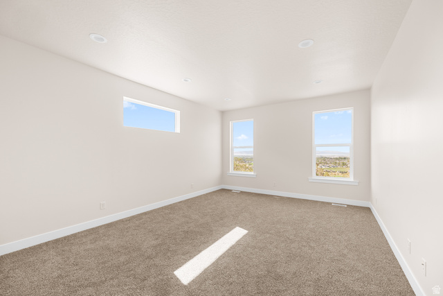 1510 West 600 North, Unit GE 04 Mapleton, UT 84664 - Photo 12 of 21 Spacious room with plush carpet flooring, recessed lighting, and crisp white walls