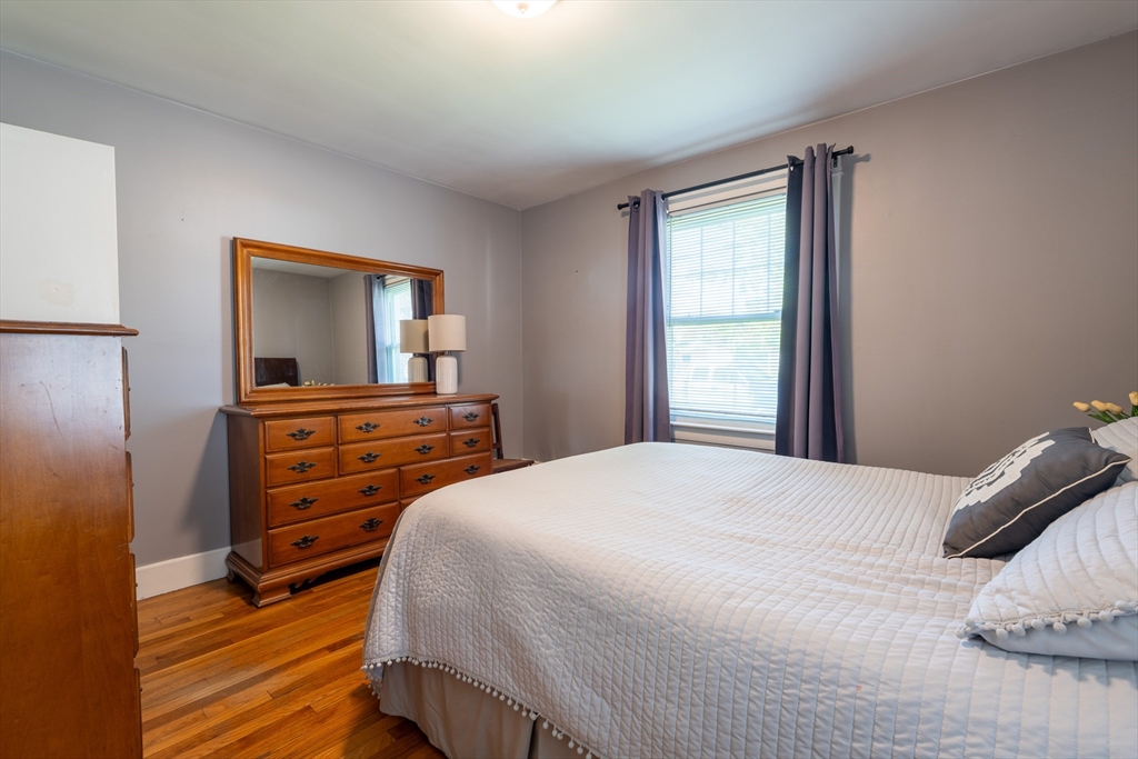 110 James M Beardsworth Road Tiverton, RI 02878 - Photo 8 of 26 a bedroom with a bed and a dresser in it