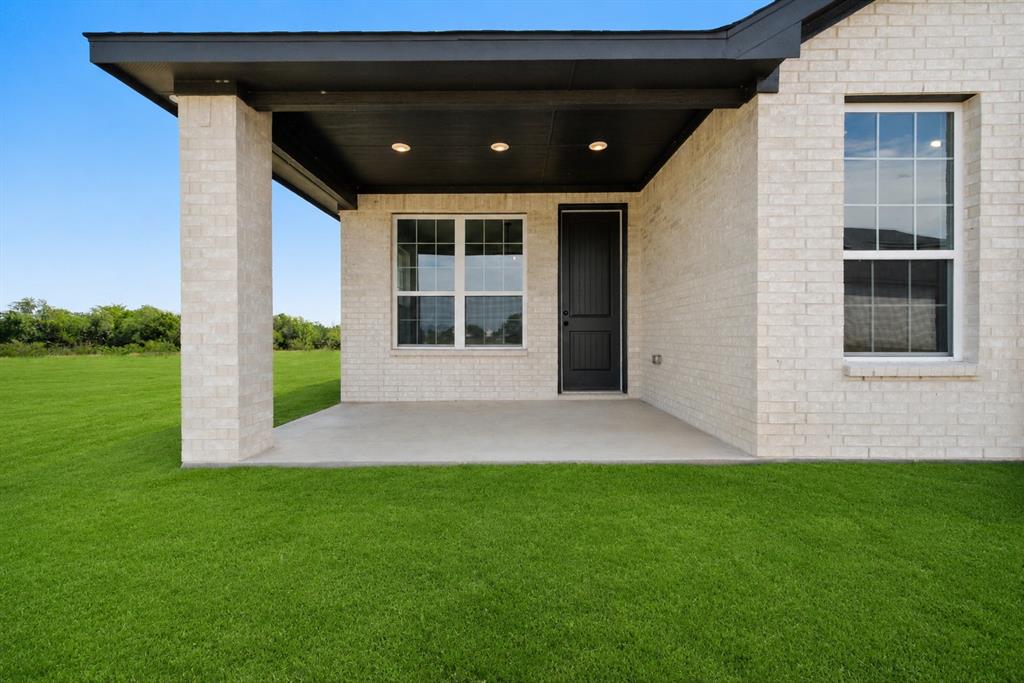 3400 Dobbins Road Corsicana, TX 75110 - Photo 31 of 40 a view of house with backyard and garden
