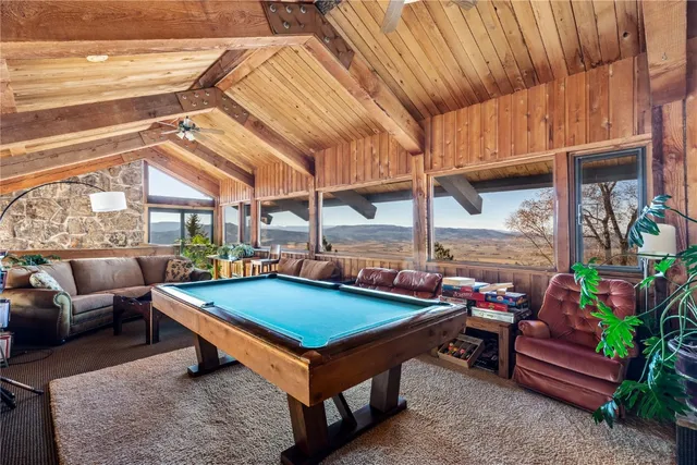 a bed sitting in a room next to a window