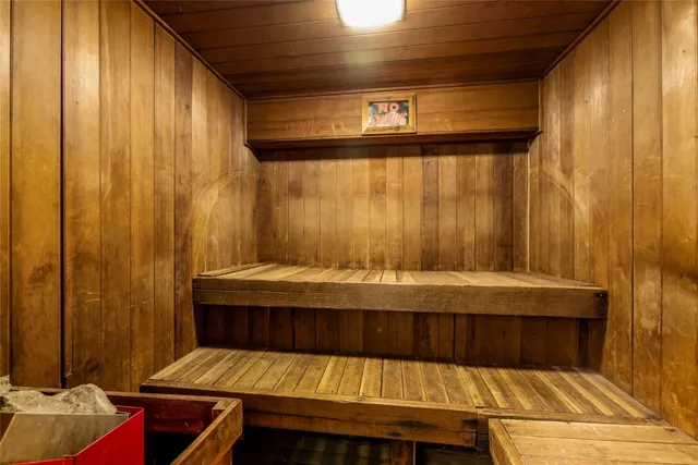 a dining room with furniture a fireplace and wooden floor