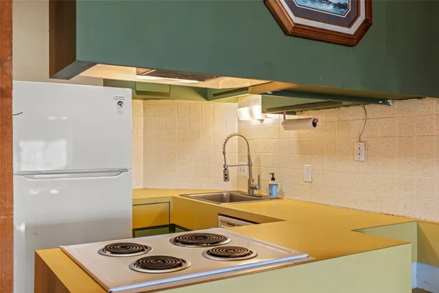 a bathroom with a sink a bath tub and a sink