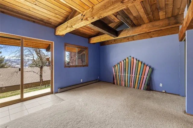 a view of an empty room with windows