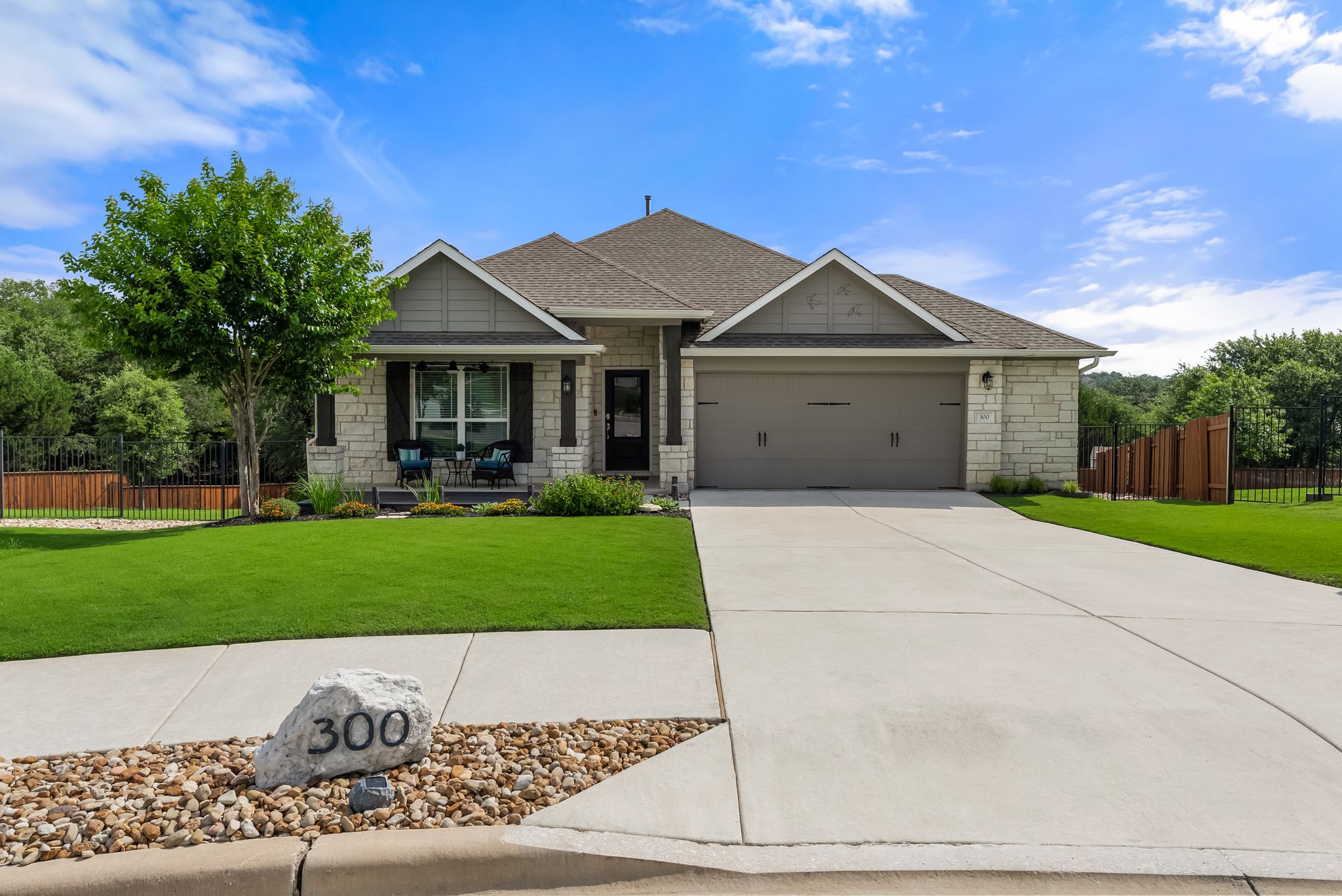 300 Prato Place Georgetown, TX 78628 - Photo 2 of 40 A well-maintained lawn and extended driveway welcome you to this charming single-story home.
