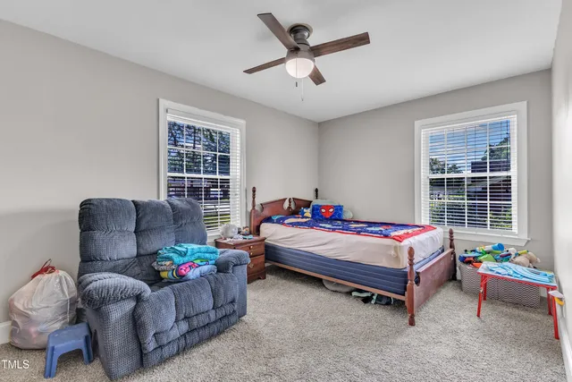 a living room with furniture and windows