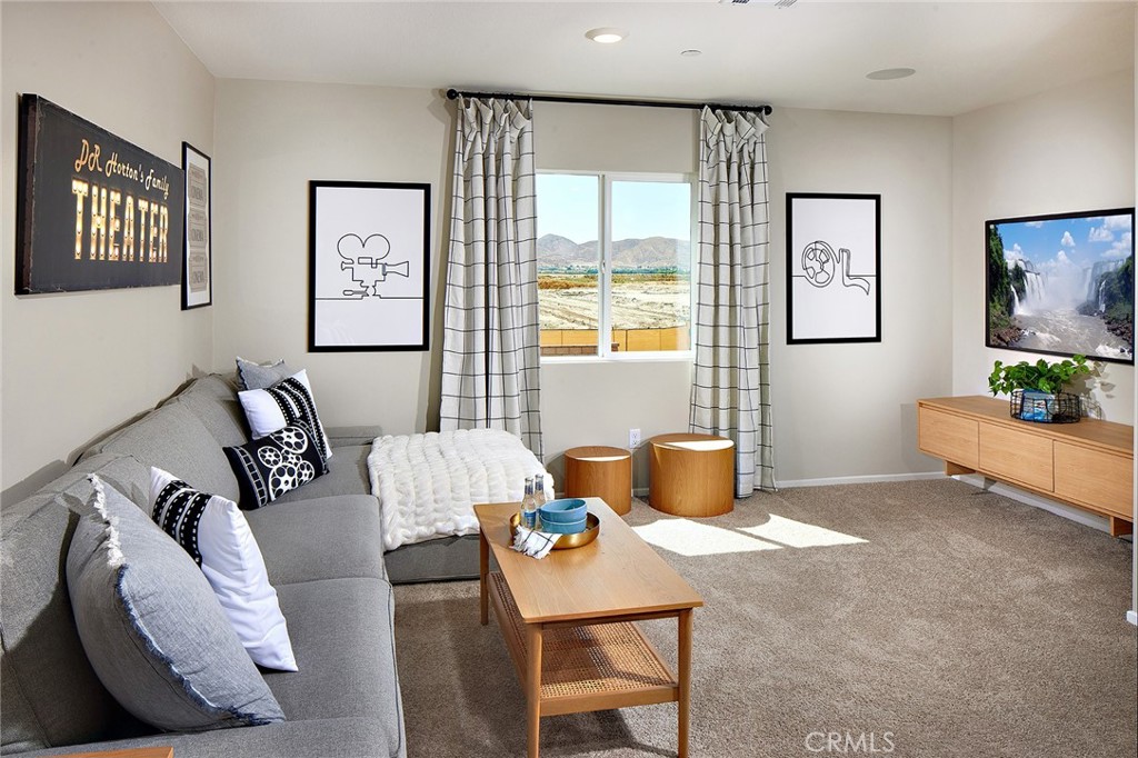 30607 Cyclone Avenue Winchester, CA 92596 - Photo 11 of 18 a living room with furniture and a flat screen tv