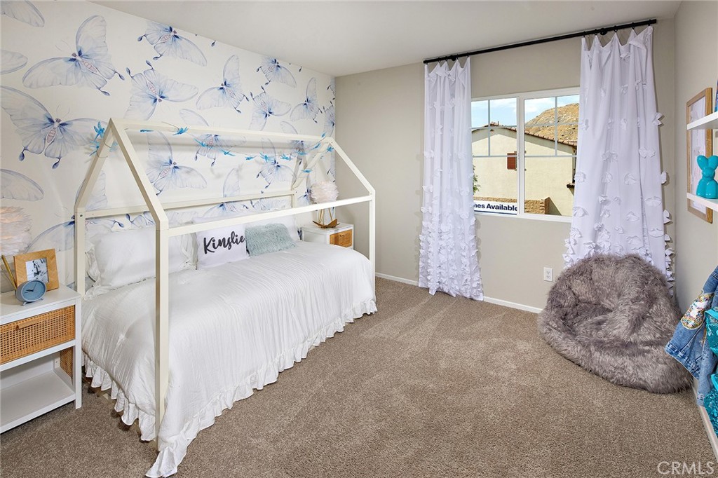 30607 Cyclone Avenue Winchester, CA 92596 - Photo 14 of 18 a bedroom with a bed and a window