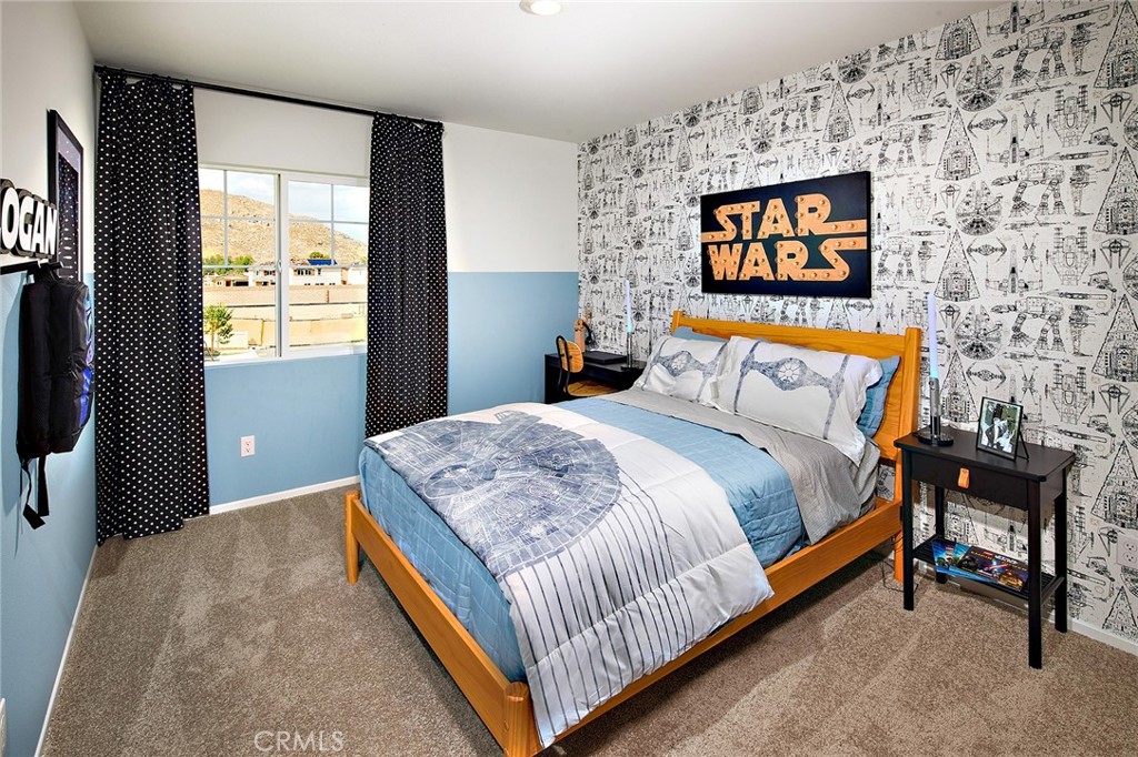 30607 Cyclone Avenue Winchester, CA 92596 - Photo 16 of 18 a bedroom with a bed and a flat screen tv