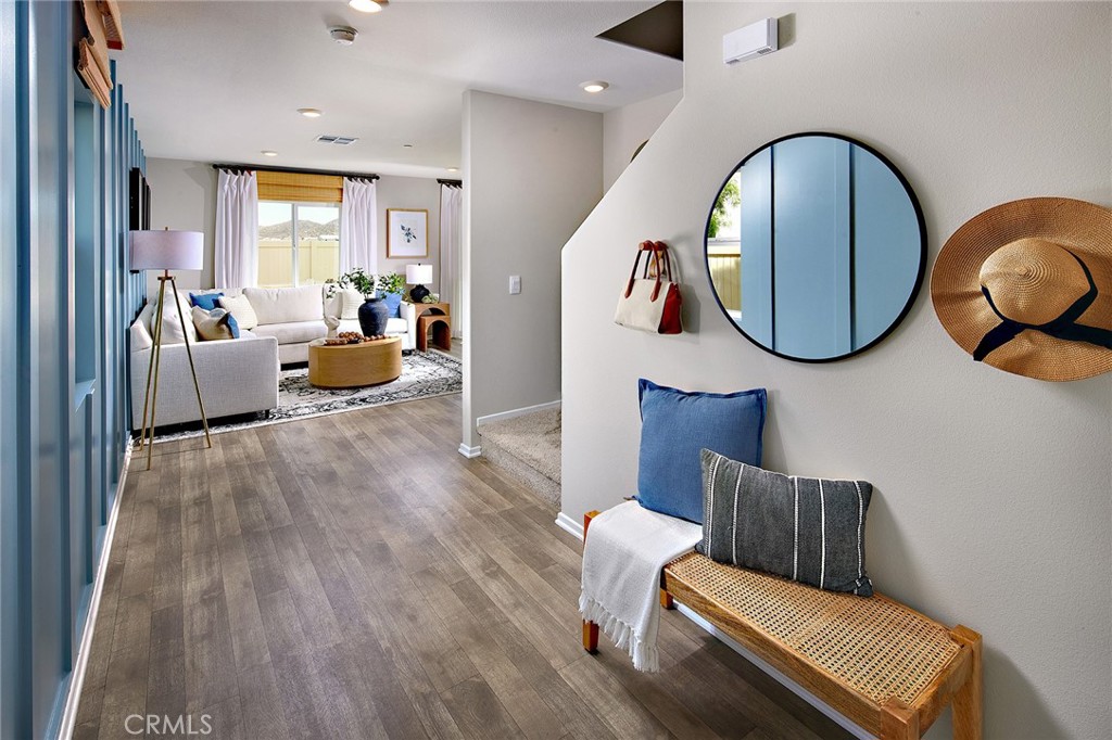 30607 Cyclone Avenue Winchester, CA 92596 - Photo 2 of 18 a living room with furniture and a large mirror