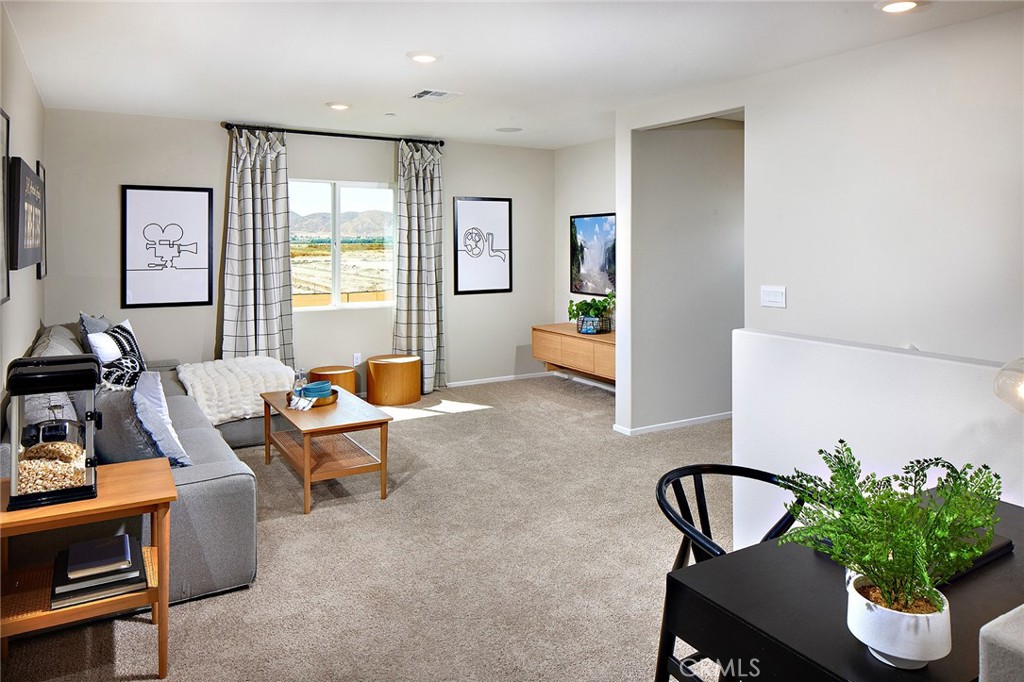 30607 Cyclone Avenue Winchester, CA 92596 - Photo 10 of 18 a living room with furniture and a potted plant