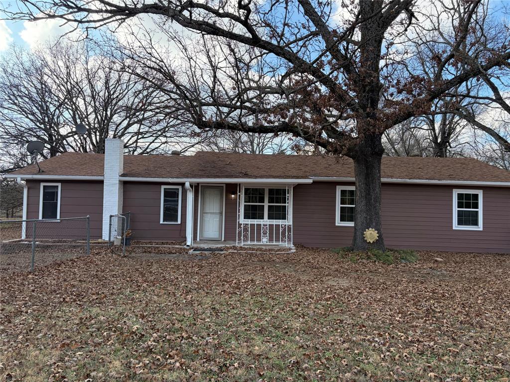 front view of a house with a trees