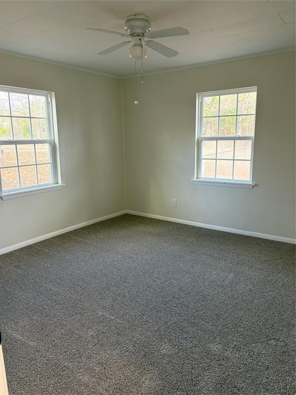 2293 County Road Powderly, TX 75473 - Photo 11 of 20 an empty room with a window