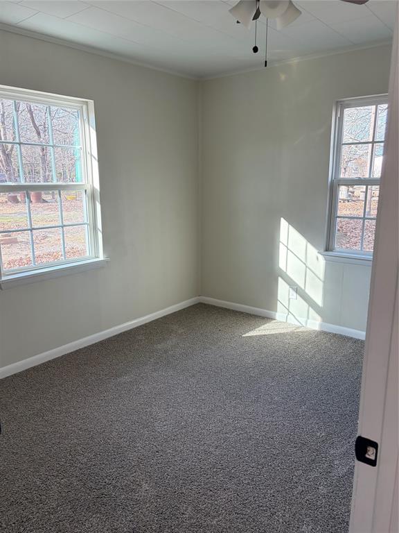 2293 County Road Powderly, TX 75473 - Photo 12 of 20 an empty room with a window