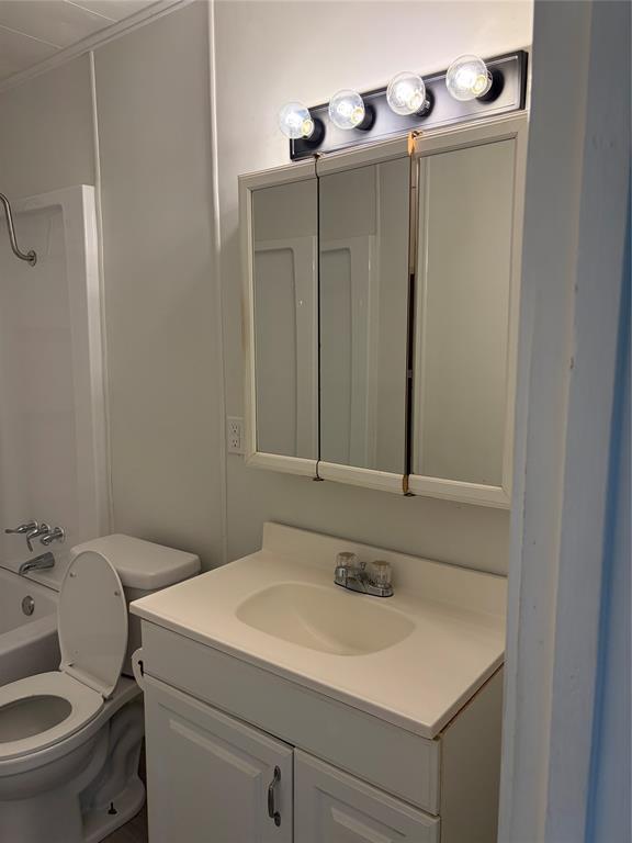 2293 County Road Powderly, TX 75473 - Photo 15 of 20 a bathroom with a sink and a toilet