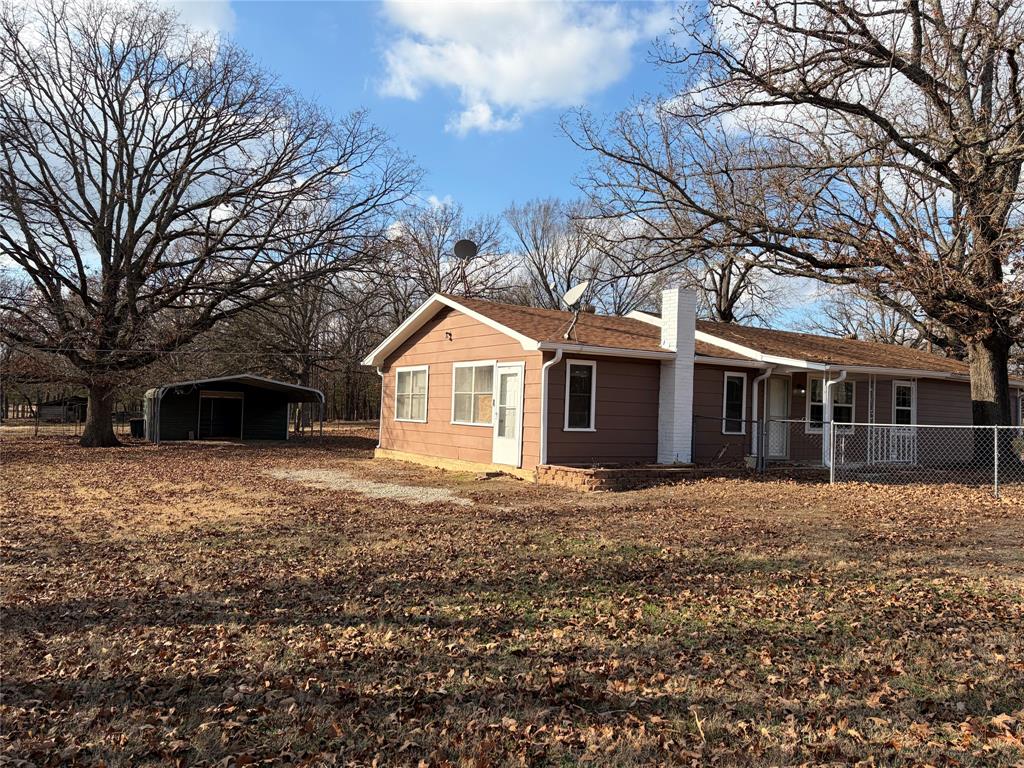 2293 County Road Powderly, TX 75473 - Photo 2 of 20 a front view of a house with a yard