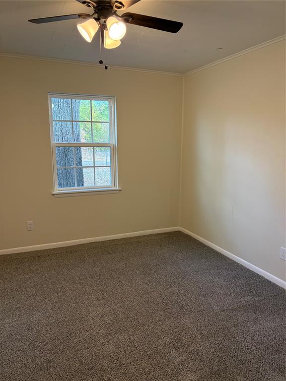 2293 County Road Powderly, TX 75473 - Photo 10 of 20 an empty room with a window