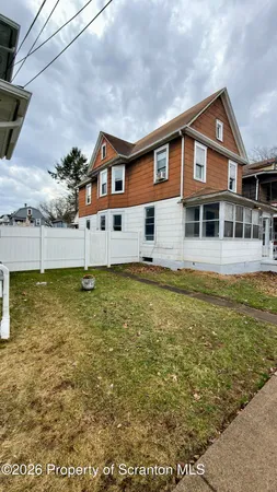 a front view of a house with swimming pool