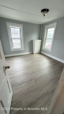a view of an empty room with a window
