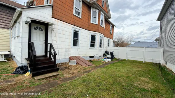 a view of a back yard of the house