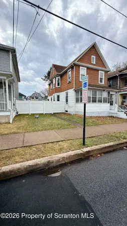 a front view of a house with a ocean view