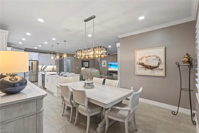 a living room with furniture and a ceiling fan