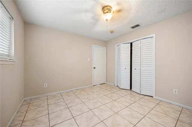 a view of an empty room and a window
