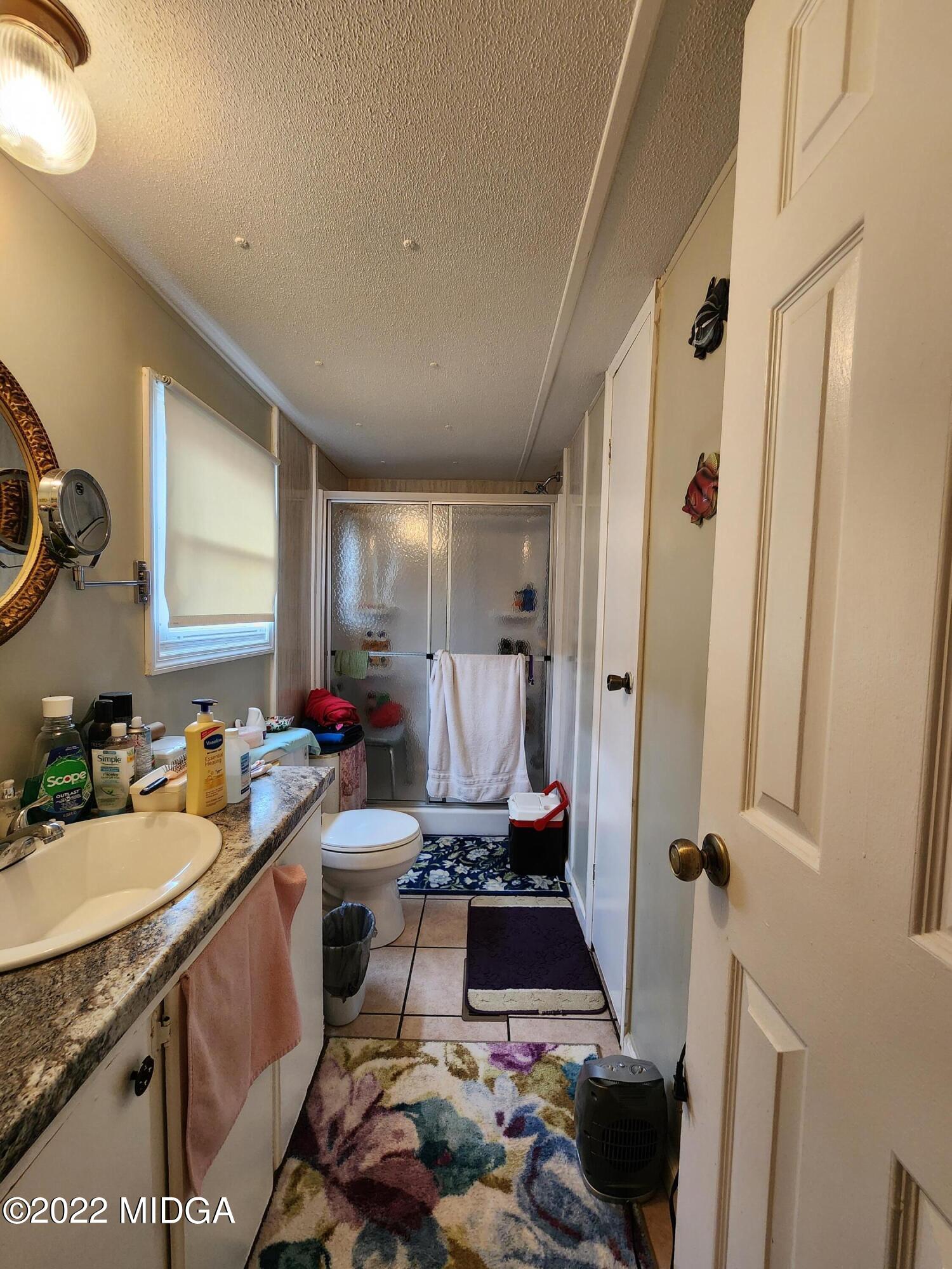 815 Pottery Road Lizella, GA 31052 - Photo 4 of 21 a room with a sink and a mirror