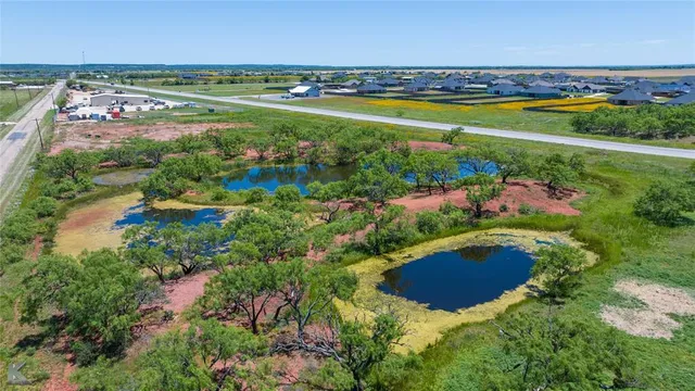 an aerial view of a house with outdoor space