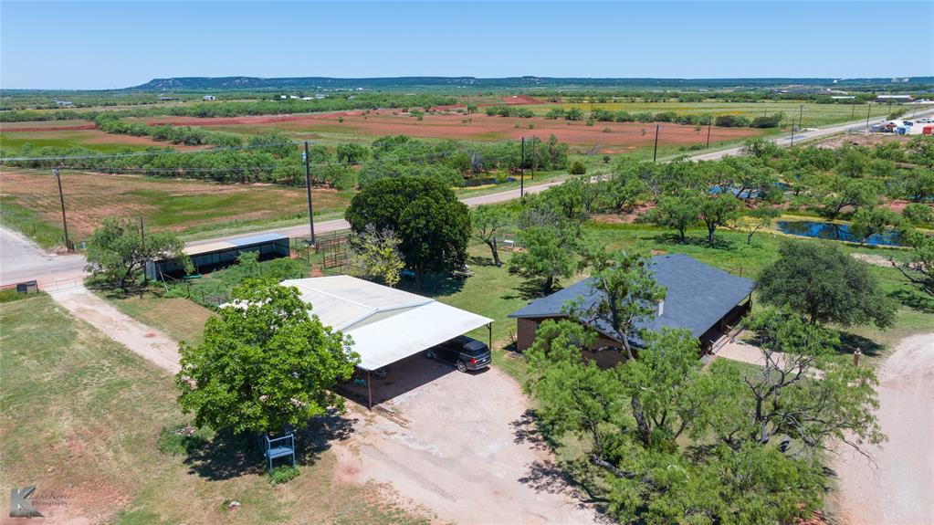 4142 Highway 83 Tuscola, TX 79562 - Photo 20 of 25 a view of a lake with a yard and mountain view