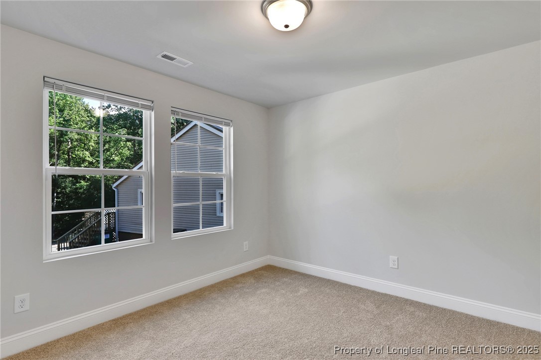 1036 Meadow Reach Sanford, NC 27332 - Photo 13 of 30 an empty room with a window