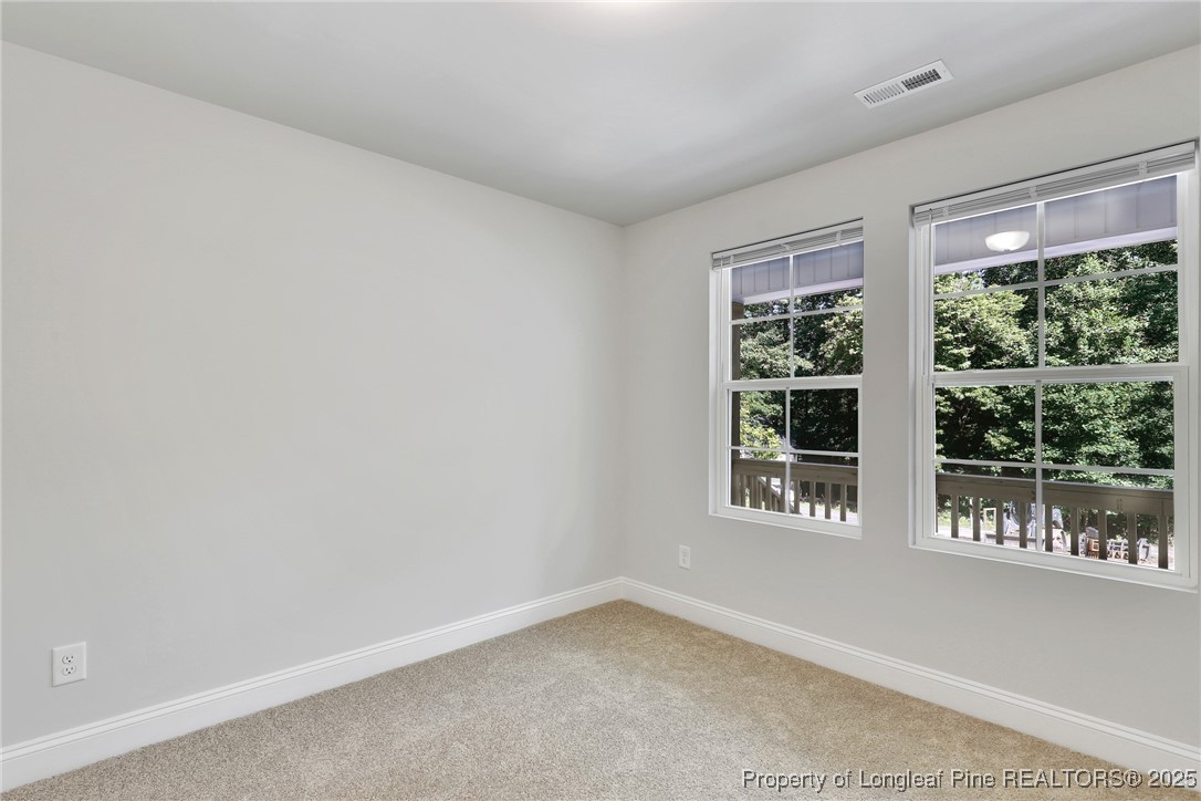 1036 Meadow Reach Sanford, NC 27332 - Photo 15 of 30 an empty room with windows