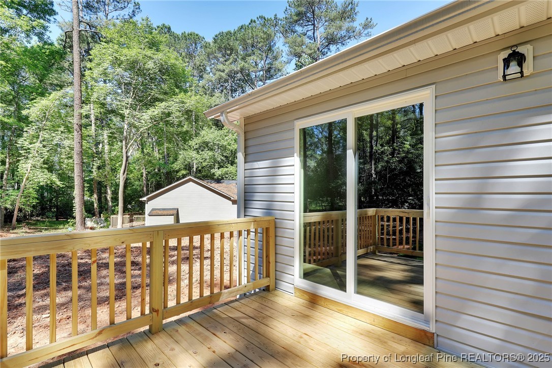 1036 Meadow Reach Sanford, NC 27332 - Photo 19 of 30 a view of a house with a balcony