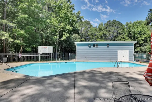 a view of a swimming pool with a lounge chair