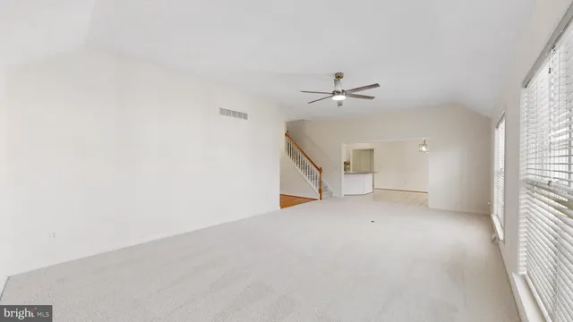 a kitchen with kitchen island a sink appliances and cabinets