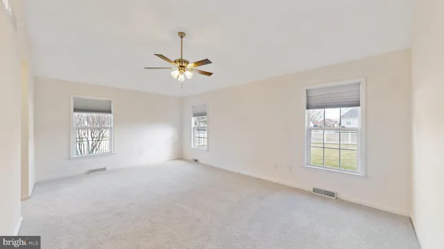 a white bath tub sitting next to a window