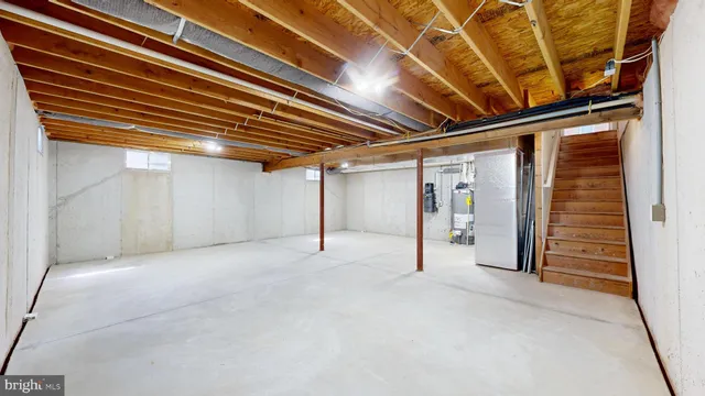 an aerial view of a house with a big yard and large trees