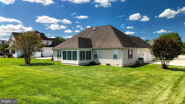 an aerial view of a house with a yard basket ball court and outdoor seating