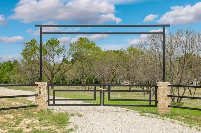 a living room with patio furniture and a fireplace