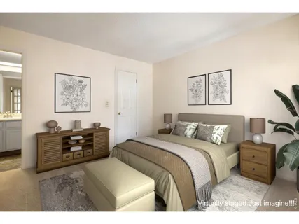 a bedroom with a bed and dresser