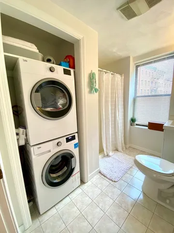 a view of a washer and dryer in a living room