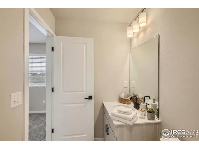 a bathroom with a toilet sink and shower