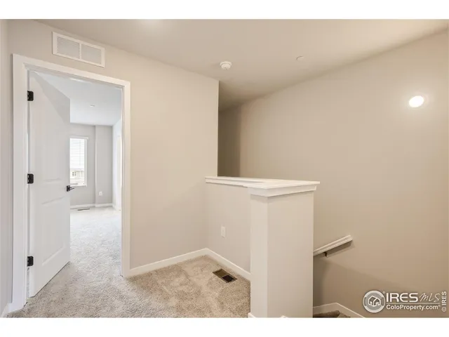 a view of a hallway with washer and dryer