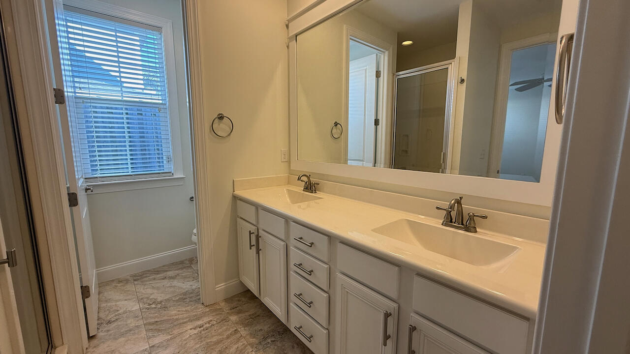 143 Christian Drive Santa Rosa Beach, FL 32459 - Photo 17 of 25 a bathroom with double sink and a mirror