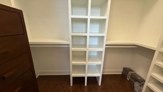 a view of an empty room with a closet