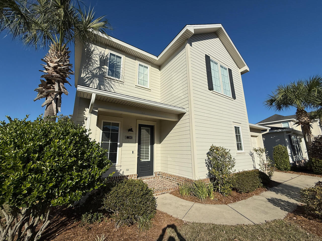 143 Christian Drive Santa Rosa Beach, FL 32459 - Photo 4 of 25 a front view of a house with a yard