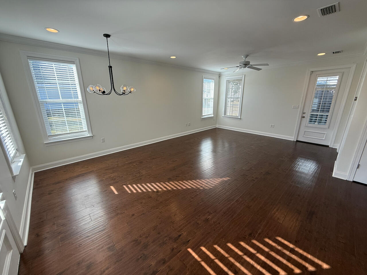 143 Christian Drive Santa Rosa Beach, FL 32459 - Photo 6 of 25 a view of an empty room with wooden floor and a window