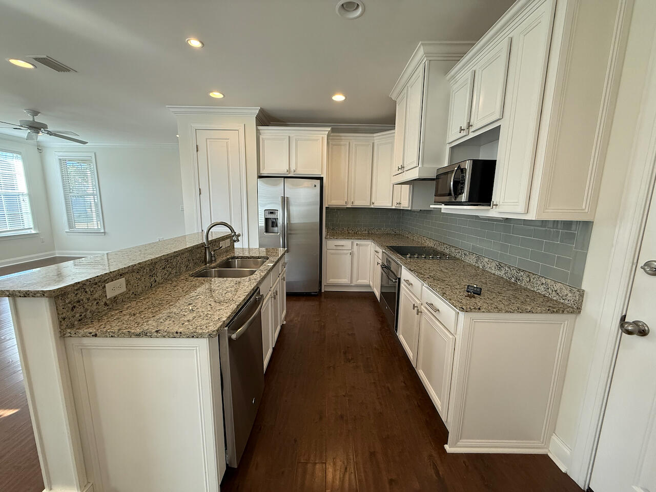 143 Christian Drive Santa Rosa Beach, FL 32459 - Photo 10 of 25 a kitchen with stainless steel appliances granite countertop a sink stove and refrigerator