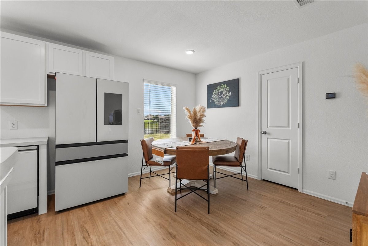 14410 Boyton Holw Trace Rosharon, TX 77583 - Photo 16 of 35 Dining area is combined with the Kitchen and offers the most gorgeous lake views.