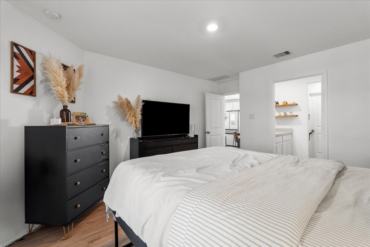 14410 Boyton Holw Trace Rosharon, TX 77583 - Photo 35 of 35 Owner's Suite is conveniently located downstairs and off the dining room. Split floor plan for those seeking a some separation from the secondary rooms.