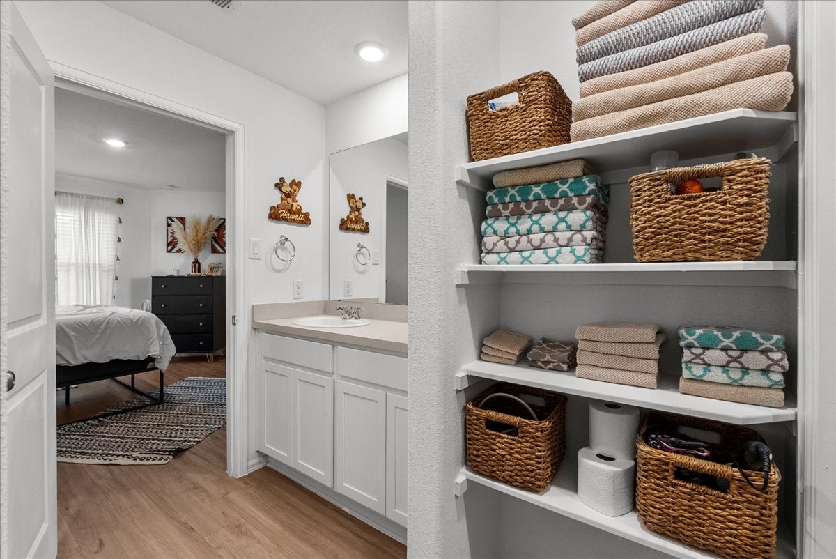 14410 Boyton Holw Trace Rosharon, TX 77583 - Photo 20 of 35 Built in Shelves expand the bath storage in this en suite bathroom.